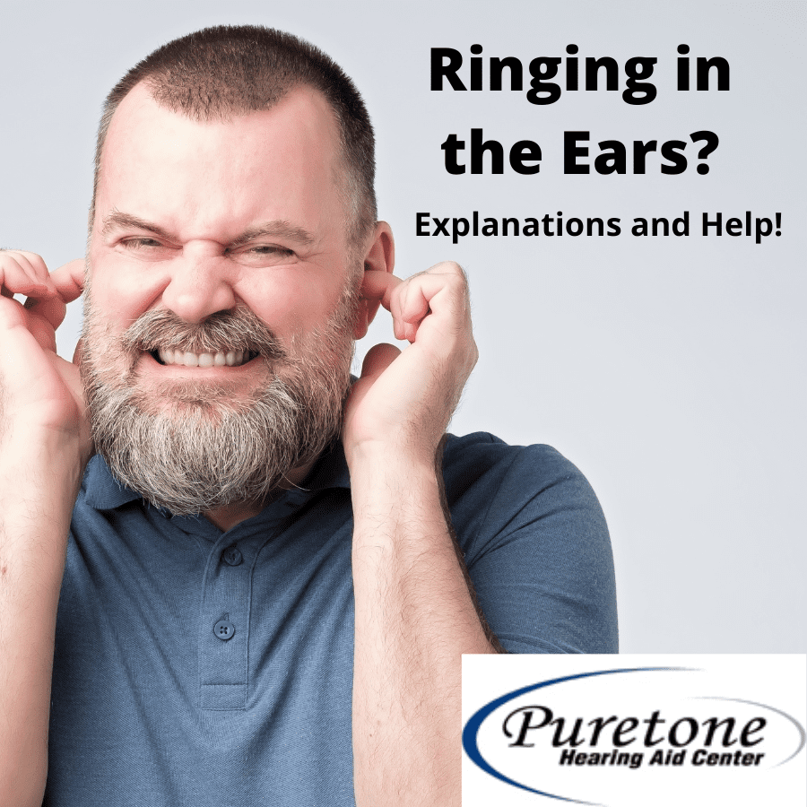 Man plugging his ears with his fingers.