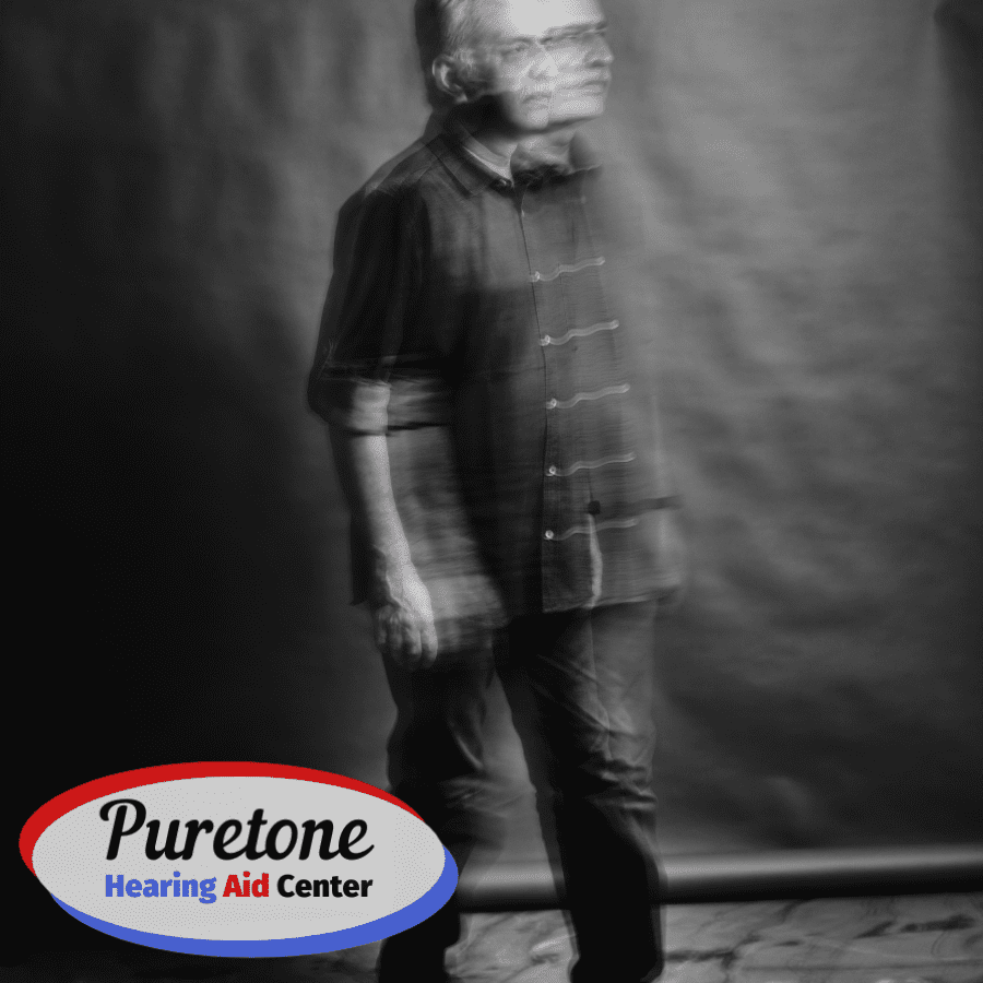 Confused man on grey background with company logo.